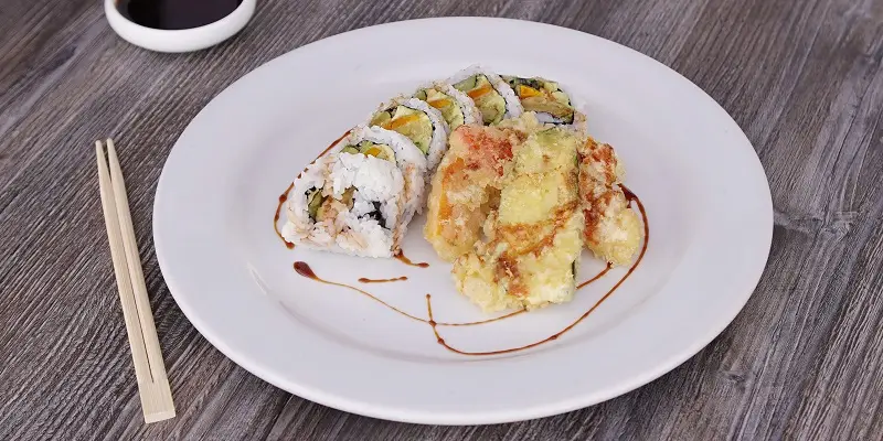 Vegetable tempura roll on a white plate