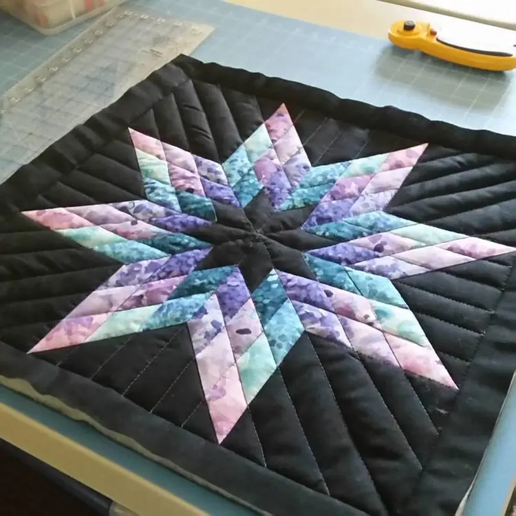 Lone star quilt on a black background