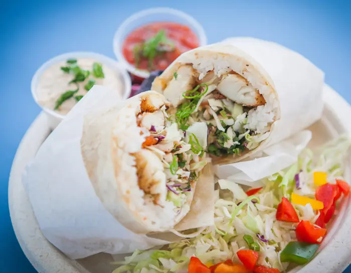 Grilled fish and shrimp burrito cut in half